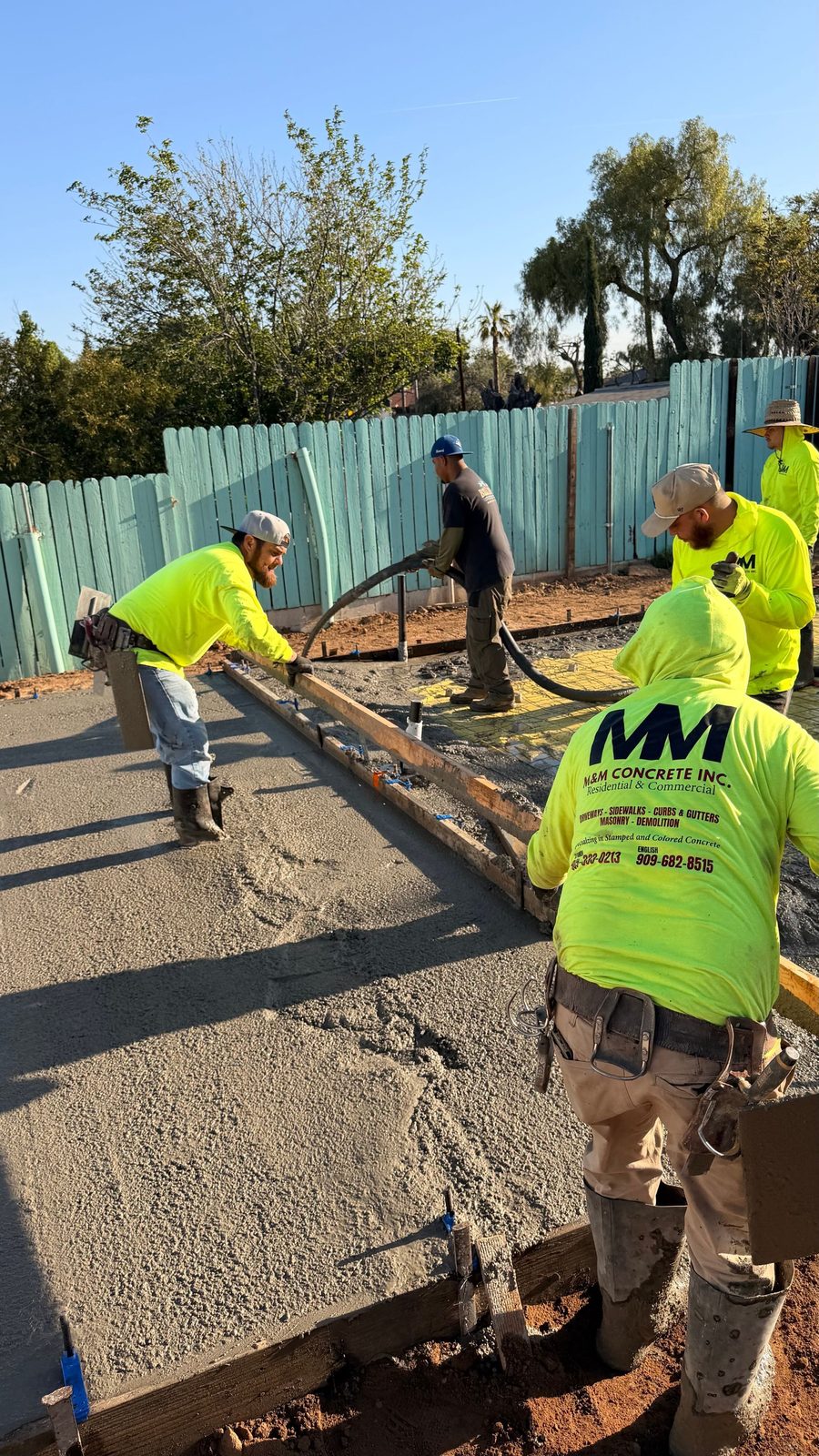M&M Concrete crew screeding a fresh ADU slab pour in Riverside